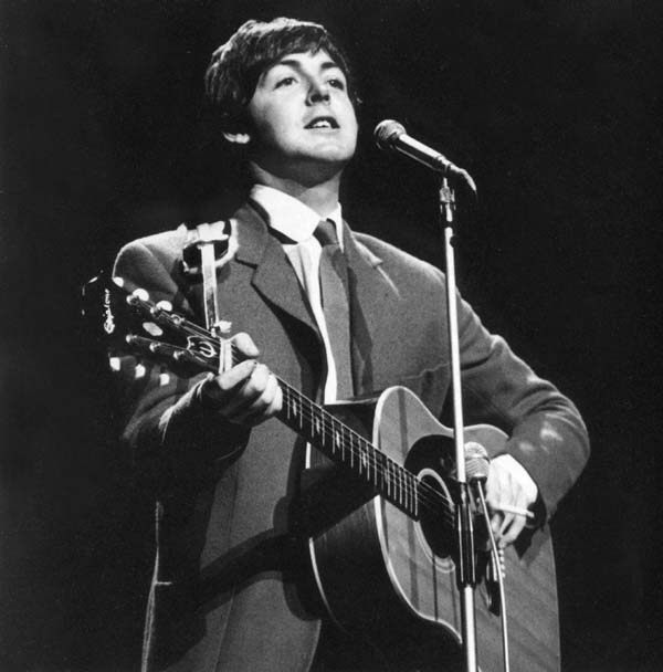 Paul McCartney performing live in the 60s